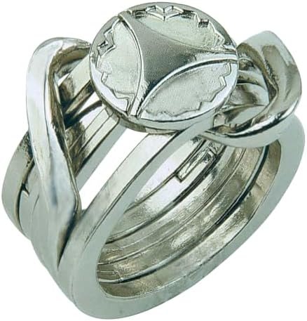 Ring hanayama cast metal puzzle assembled on a work bench